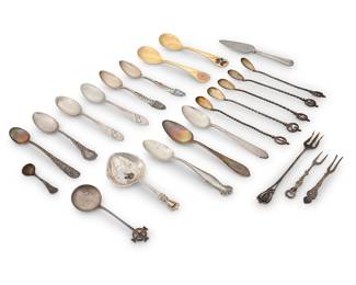 1214 A group of silver utensils 19th/20th century Five spoons unmarked and tested for .800 silver, one fork marked for .800 silver, the rest with factory marks for sterling Comprising various spoons and serving utensils 23 pieces Longest utensil 6 3/8 in. Total weighable silver 12.7 gross oz. troy approximately Estimate: $500 - $800