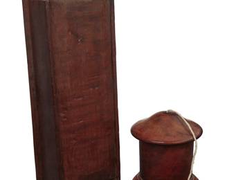 1056 A Georgian burl walnut twine box and Queen Anne oak candle box 18th century The wall-mounting candle box with lift-up sliding door, the twine box with screw-on cap 2 pieces Twine box height 5 1/8 in., diameter 4 3/8 in.; candle box height 13 3/8 in., width 4 3/4 in., depth 3 1/8 in. Estimate: $400 - $600