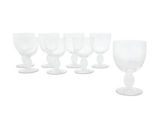 1310 A set of eight Lalique glass 'Langeais' water goblets Late 20th century Designed 1976 by Marc Lalique (1900-1977) Each etched: Lalique ® France Comprising three water goblets and five taller water goblets 8 pieces Height of taller 6 1/8 in.; height of shorter 5 3/4 in. Estimate: $400 - $600