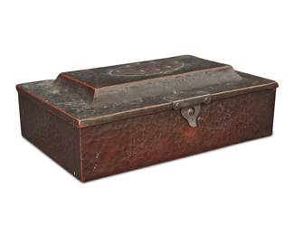 1114 An Arts & Crafts hammered copper box Early 20th century Appears unmarked With silvered hinges and top medallion, opening to reveal a cedar-lined interior Height 3 in., width 9 1/4 in., depth 5 7/8 in. Estimate: $200 - $400