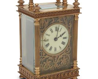 1053 A French gilt brass carriage clock Late 19th/early 20th century Marked to movement: MADE IN FRANCE The glazed case with handle housing a single-movement clock with enameled dial bearing Roman numerals, within a leather carrying case Height with handle 5 3/4 in., width 3 1/8 in., depth 2 1/2 in.; height in case 5 3/4 in., width 4 1/8 in., depth 3 1/2 in. Estimate: $200 - $400