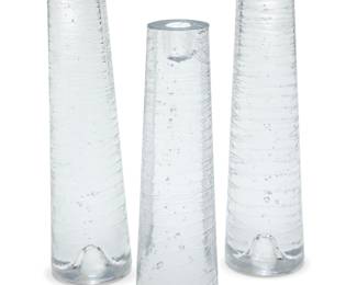 1321 Anders Färdig (b. 20th century) A set of three glass 'Spear' candlesticks for Kosta Boda, early 21st century One with factory label remnant 3 pieces Height of tallest 13 1/4 in., diameter 3 3/8 in.; shortest height 11 1/2 in., diameter 3 1/4 in. Estimate: $200 - $400