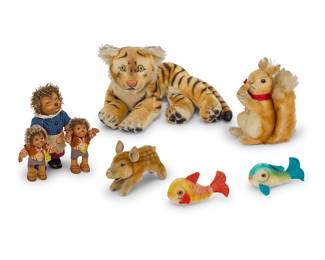 1276 A group of eight Steiff stuffed animals and dolls Early/mid-20th century The pig, Micki, and Macki each with original factory tag Comprising a tiger, two fish, a pig, a squirrel, a "Micki" hedgehog doll, and two "Macki" hedgehog dolls 8 pieces Height of tiger 7 1/4 in., width 12 1/4 in., depth 11 in.; height of Micki 7 1/2 in. Estimate: $100 - $200