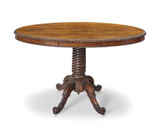 1161 A Victorian rosewood breakfast table Late 19th/early 20th century With gadrooned edge and single drawer, raised on a turned support column with four scrolling legs terminating in casters Height 29 in., width 46 1/4 in., depth 26 1/4 in. Estimate: $400 - $600