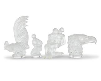 1095 Four Lalique glass articles Late 20th/early 21st century Each etched: Lalique ® France Comprising a 'Coq Nain' rooster, 'Tete D'Aigle' eagle head, 'Danseurs Enlacés' figural group, and another figural group of Diana and the Fawn 4 pieces Rooster height 8 1/4 in., width 5 1/2 in., depth 2 3/4 in. Estimate: $500 - $700
