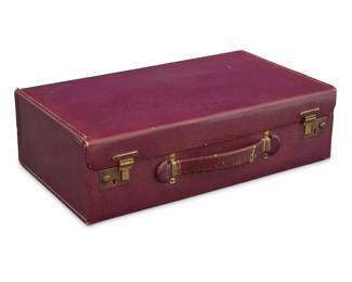 1294 An English cased sterling mounted vanity set from actress Beverly Roberts (1914-2009) Circa 1930 The smooth purple leather travelling case holding a fitted vanity set including six glass bottles and jars, two natural bristle brushes, a handled mirror, a shoehorn/button hook, and a file, as well as a pair of associated sterling silver scissors, a sterling silver monogrammed charm on a chain, and with personal ephemera including photographs, Actor's Equity and other association cards, and a typed personal biography/resumé Case and most items made in England, retailed by J.W. Robinson; most silver stamped G. C & S for maker, for UK sterling, London, 1930; scissors stamped for sterling, and for Birmingham 13 pieces plus ephemera Largest piece height 7 3/4 in., width 4 3/4 in., depth 1/4 in.; case height 8 1/4 in., width 14 3/8 in., depth 4 1/8 in. Weighable sterling 22.02 gross oz. troy approximately Estimate: $400 - $600