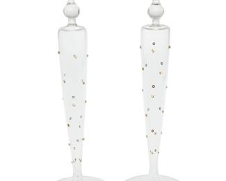 1035 A pair of Matthew Varga studio glass candlesticks Late 20th century Each with etched signature: Matthew Varga 2 pieces Height of each 15 1/4 in., diameter 5 in. Estimate: $200 - $400