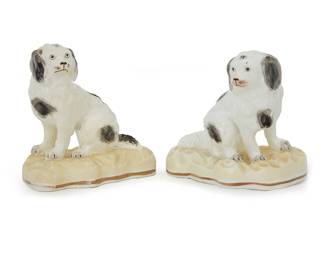 1228 Two Rockingham porcelain models of spaniels 20th century One faintly marked: Rockingham; and impressed: 121 2 pieces Taller height 5 1/8 in., width 5 in., depth 3 in.; shorter height 4 3/4 in., width 5 1/4 in., depth 3 7/8 in. Estimate: $100 - $200