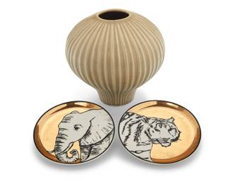 1241 Three Jonathan Adler ceramic table items Late 20th/early 21st century Each stamped or printed with factory mark Comprising a glazed ceramic 'Pot-Au-Porter' lantern vase and two parcel-gilt coasters from the 'Animalia' set 3 pieces Vase height 5 1/8 in., diameter 5 1/2 in.; diameter of each coaster 4 in. Estimate: $150 - $250