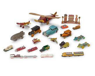 1098 A group of American enameled tin toys Early 20th century Comprising a gas station and various cars, trains, and airplanes 21 pieces Height of largest 6 in., width 17 1/2 in., depth 17 in. Estimate: $600 - $800