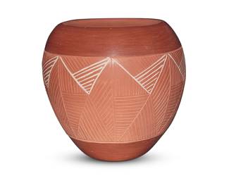 1304 Rosita de Herrera (b. 1940, San Juan Pueblo) A redware pottery jar, late 20th/early 21st century Signed and inscribed to underside: Rosita De Herrera / San Juan Pueblo / N.M. The jar with a band of sgraffito fine-line work within a matte micaceous ground, some in-filled with white slip paint Height 6 1/8 in., diameter 6 3/8 in. Estimate: $100 - $200
