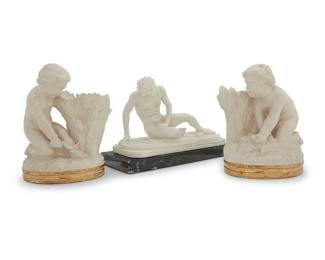 1080 A group of three classical figures 20th century Gaul with applied label and incised: A Santini; impressed: GALLO MORENTE Comprising a pair of plaster figural putti bookends, and a porcelain reclining figure of the Dying Gaul, on a marble plinth 5 pieces Height of each bookend 6 1/5 in., width 5 1/2 in., depth 6 in.; Gaul overall height 6 in., width 9 1/8 in., depth 3 7/8 in. Estimate: $150 - $250