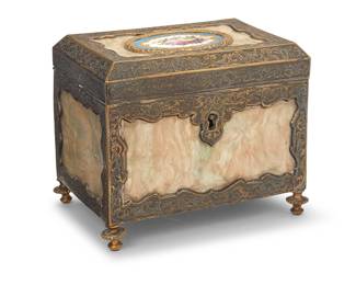 1311 A porcelain mounted silvered and gilt jewelry box Early 20th century Chased with scrolling foliate motifs in the metal, and painted floral motifs to central porcelain mounted to a locking lid, opening to reveal a velvet-lined interior Height 4 5/8 in., width 5 5/8 in., depth 4 in. Estimate: $300 - $400