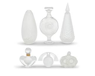 1279 A group of five Lalique glass scent bottles and a vase Late 20th century Each etched: Lalique ® France Comprising perfume bottles 'Deux Fleurs,' 'Eclipse,' 'Perles,' 'Moulin Rouge,' and Nina Ricci 'Farouche,' and a 'Coeur de Fleur' bud vase 6 pieces Tallest height 7 1/2 in., diameter 3 in.; height of shortest 3 1/8 in., width 4 1/2 in, depth 2 1/8 in. Estimate: $400 - $600