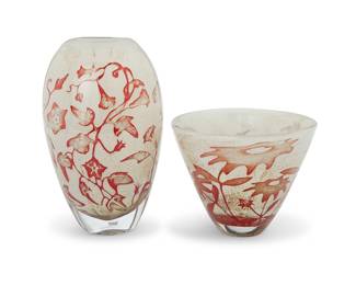 1126 Olle Brozén (b. 1963) A cased glass 'Floating Flowers' vase and bowl for Kosta Boda, early 21st century Each etched: KOSTA BODA / O BROZEN; one numbered indecipherably, the other: 7040415; each with applied factory labels 2 pieces Vase height 10 3/8 in., width 6 1/4 in., depth 4 1/2 in.; height of bowl 6 in., diameter 7 5/8 in. Estimate: $200 - $400