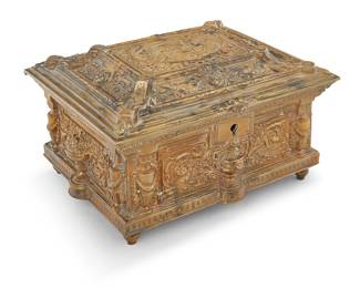 1020 A Renaissance Revival brass jewelry box Early 20th century, possibly Jennings Brothers The architectural box decorated with urns and profuse foliate motifs, the locking lid depicting Cupid and Aphrodite Height 4 5/8 in., width 7 5/8 in., depth 6 5/8 in. Estimate: $300 - $500