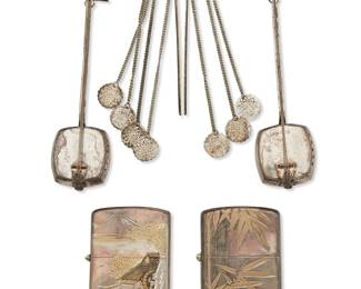 1283 Four Japanese sterling silver table items and a metal hairpin 20th century Comprising a pair of sterling silver lighter cases, a pair of shamisen-form sterling silver salt and pepper shakers, and a metal hairpin, each in an associated wood box 5 pieces Height of largest box 1 1/8 in., width 5 1/4 in., depth 3 1/2 in.; length of shamisens 4 3/8 in. Total sterling weight 3.2 oz. troy approximately Estimate: $200 - $300