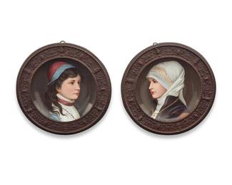 1031 A pair of Vienna style bronze framed porcelain cabinet plates Early 20th century Numbered: 1522 [or] 1534 Each hand-painted depicting a lady, within a cast bronze frame with neoclassical motifs and masks 2 pieces Overall diameter of each 8 7/8 in., depth 1 1/2 in. Estimate: $300 - $500