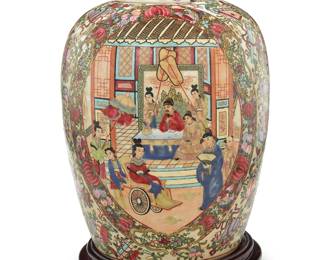 1220 A Chinese Famille Rose porcelain lidded ginger jar Late Qing dynasty/Republic era (1644-1949) Stamped with apocryphal reign mark for Qianlong period (1736-1795) Depicting two figural scenes in friezes and a One Hundred Antiques field, raised on a carved wood stand Jar height 15 in., diameter 10 1/4 in.; stand height 2 1/8 in., diameter 9 1/8 in. Estimate: $200 - $300