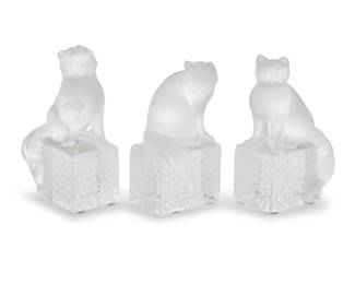 1187 Three Lalique glass cat paperweights Late 20th/early 21st century Each etched to underside: Lalique ® France; one with model number to factory label: 11679 3 pieces Tallest height 5 1/2 in., width 3 1/2 in., depth 2 3/8 in. Estimate: $300 - $500