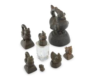1036 An assembled set of Burmo-Thai bronze figural opium weights Circa 18th/19th century Each in the form of a rooster or hen, one mounted to an acrylic plinth 7 pieces Largest height 4 1/2 in., width 3 1/8 in., depth 3 in.; smallest height 1 in. Estimate: $150 - $250
