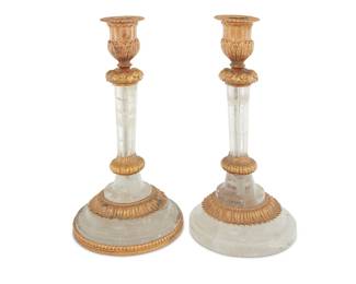 1293 A pair of gilt bronze mounted rock crystal candlesticks Late 20th century With foliate-form mounts 2 pieces Height of each 7 3/4 in., diameter 4 in. Estimate: $300 - $500