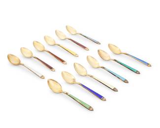 1009 A set of twelve Cartier sterling silver gilt and enamel demitasse spoons Second/third quarter 20th century Each marked for Watson and for sterling Retailed by Cartier, each with gold wash and in original case 12 pieces Each length 4 1/4 in.; case height 1 3/8 in., width 14 1/8 in., depth 6 in. Estimate: $300 - $500
