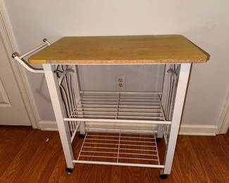 Rolling white metal kitchen cart with light wood-grain finish top