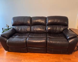 Dark brown dual-reclining sofa.