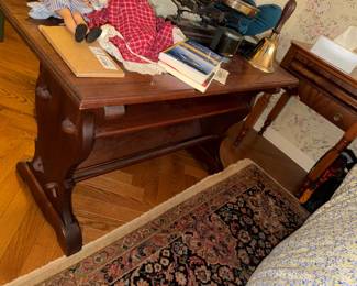 Trestle-base console table with a lower shelf / book trough