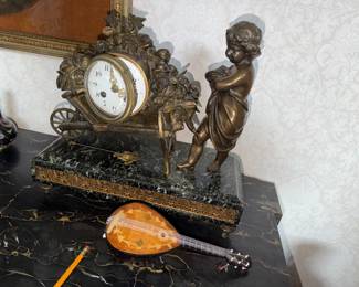 Antique French (?)  figural Mantel Clock with key (and a little wind up ukulele) no