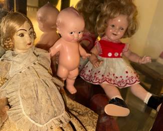 KEWPIE baby doll trading glances with the Antique lady to his right (he must've farted!),  Shirley Temple looks she's on good meds!