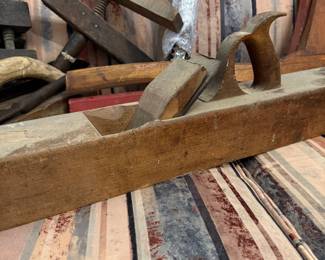 Antique wooden jointer plane and bar clamps