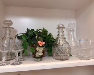 Cut glass decanters with cordial glasses