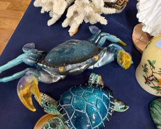 Ceramic crab and sea turtle figurines with white coral
