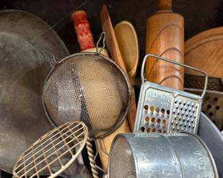 Assorted vintage kitchen utensils and sifter