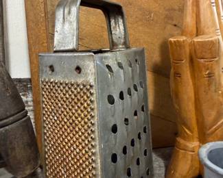 Antique tin box grater and wooden mallet