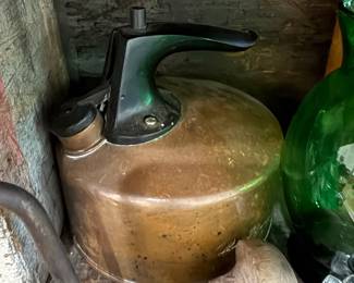 Antique copper tea kettle with black handle