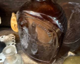 Amber glass Mount Rushmore commemorative flask