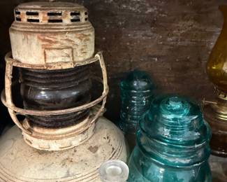 Antique nautical lantern with aqua glass insulators