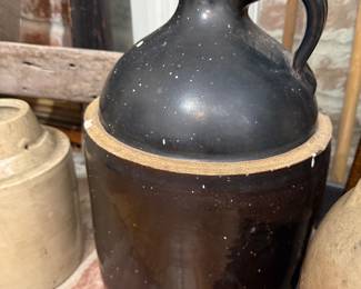 Antique brown glazed stoneware whiskey jug