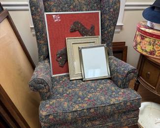 Floral wingback chair with framed mirrors