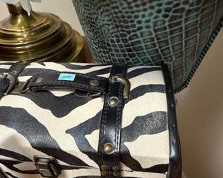 Zebra print studded travel trunk