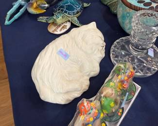 White ceramic sleeping cat with sea life figurines