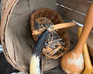 Bushel basket of antique wooden clothespins and powder horn