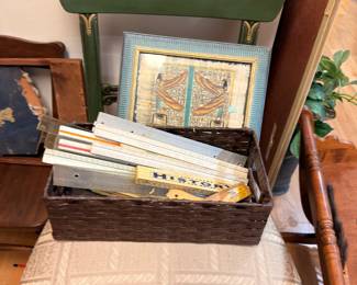 Basket of vintage folding rulers and yardsticks