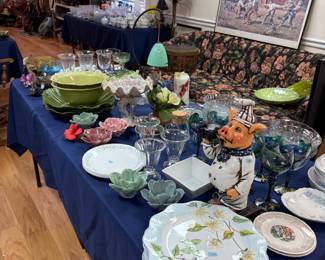 Table of glassware and majolica cabbage ware