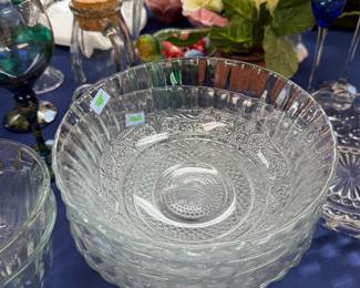 Stack of pressed glass serving bowls