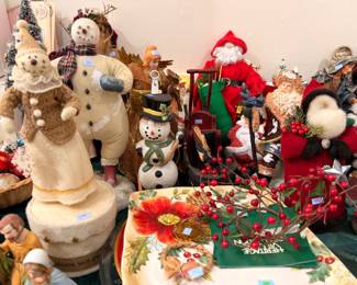 Snowman figurines with holiday serving platters