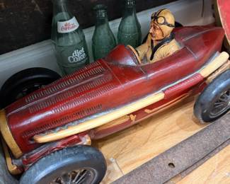 Large vintage race car model with driver figure